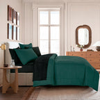 Reversible-Look Dark Green and Black 7-Piece Comforter and Sheet Set, styled on a made bed