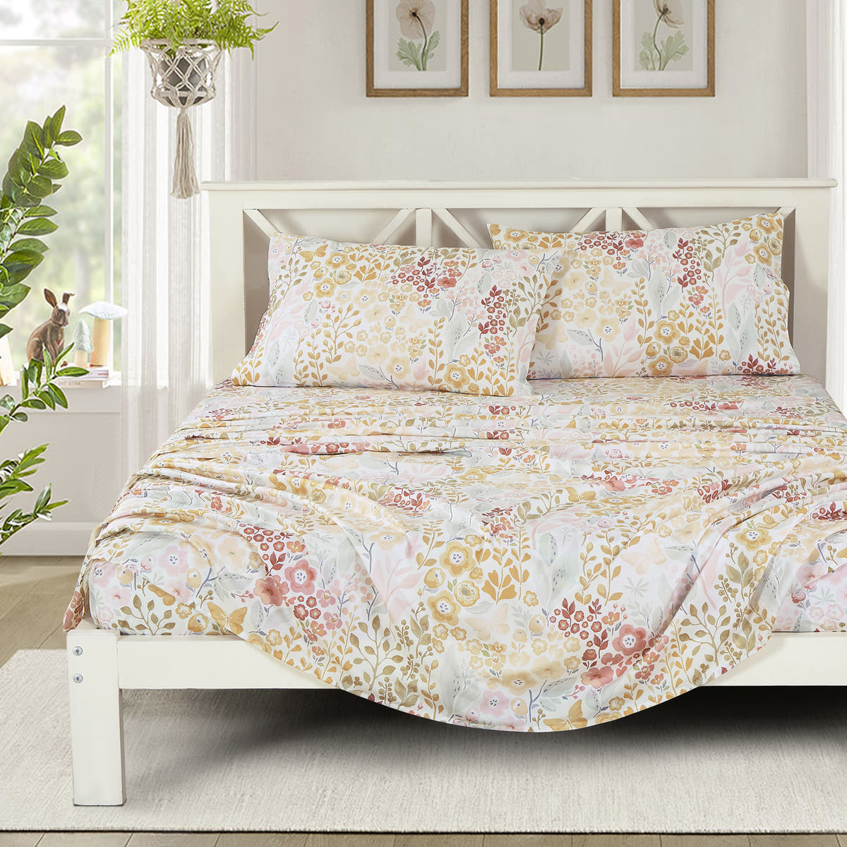 Yellow & Blush Floral sheet set on a bed