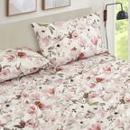 Blush Floral sheet set on a bed