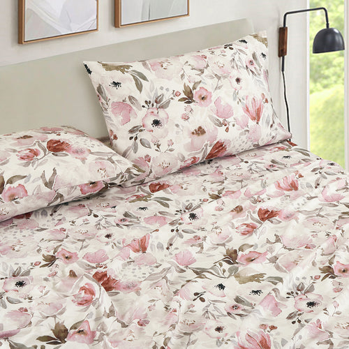 Blush Floral sheet set on a bed