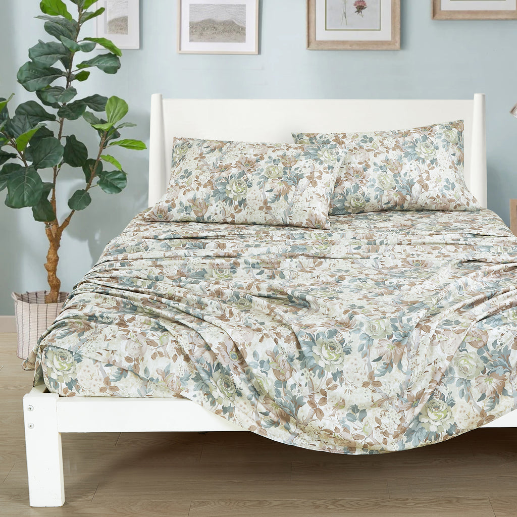 Sage & Taupe Floral sheet set on a bed
