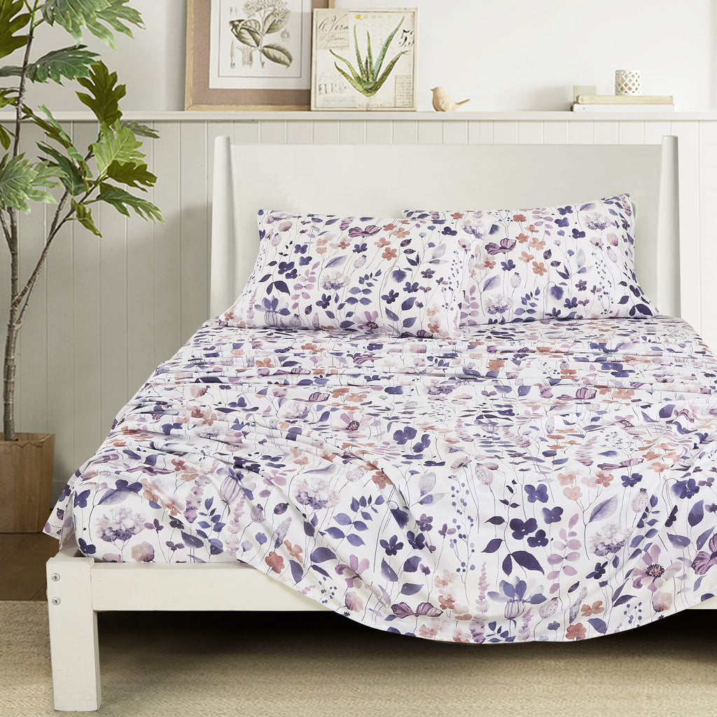 Purple Floral sheet set on a bed
