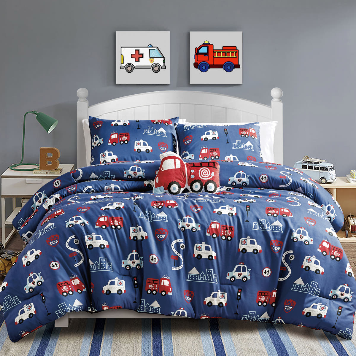Navy Fire Truck comforter set on a bed