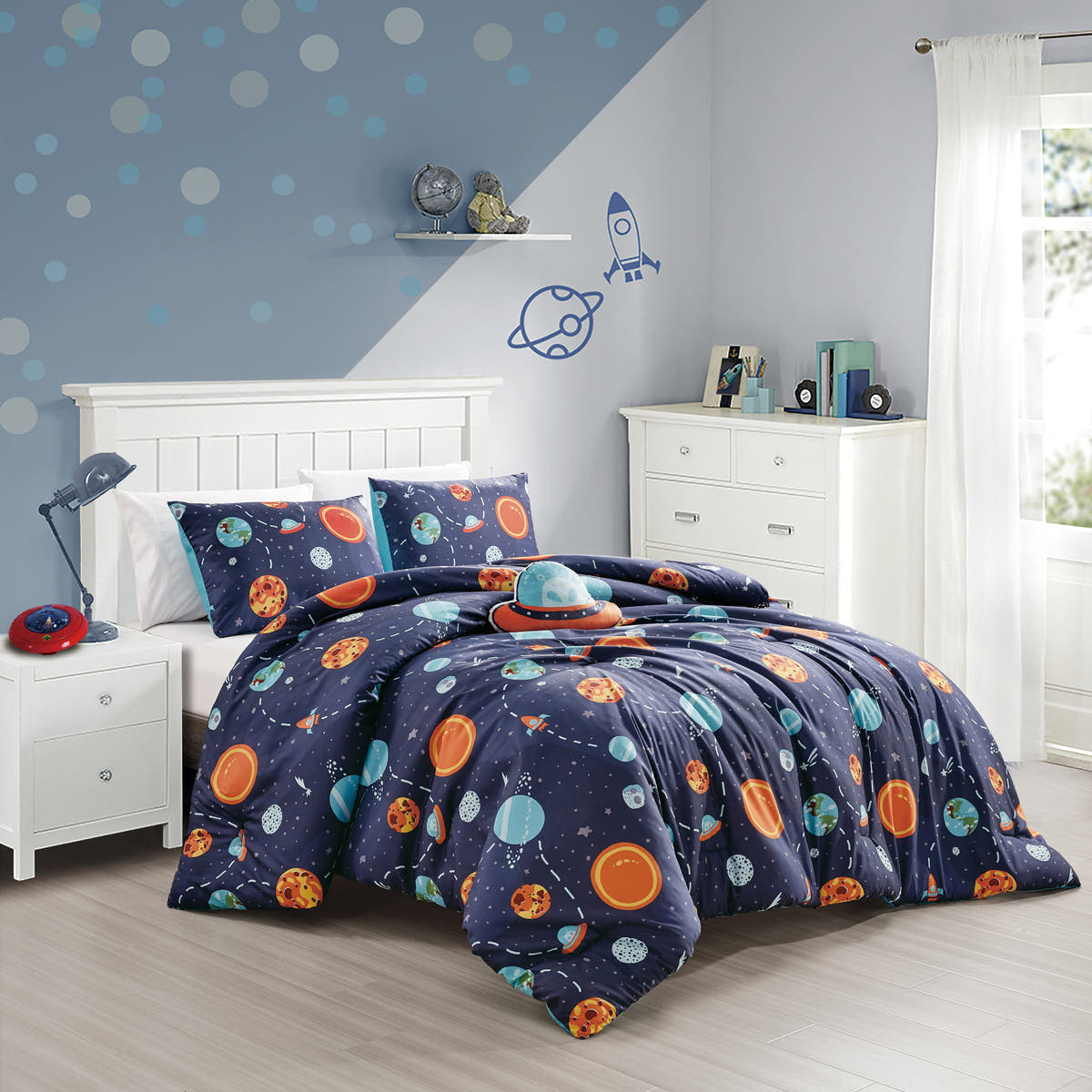 Navy Planet Print comforter set on a bed