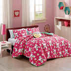 Pink Unicorn Rainbow comforter set on a bed